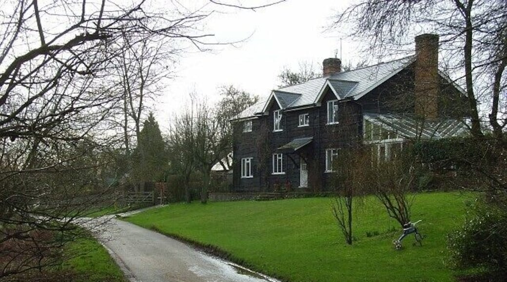 Ibstone Cottage, Ibstone Standing on the lane to the north of Hellcorner Farm, this new house is clad in dark timber. Its slate roof reflects a hint of sunshine.