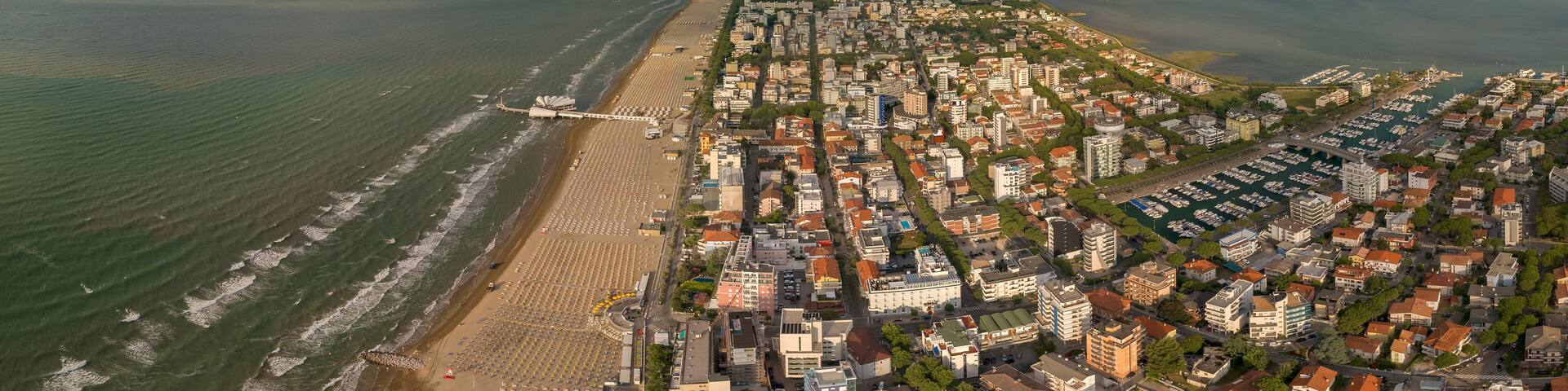 Marina Punta Faro in town Lignano Sabbiadoro Italy. Marano Lagoon meet Adriatic Sea, creating wonderful contrast of colours. Yacht Club, Bau beach Lignano, Cafe, Restaurants and hotel. Shipyard summer