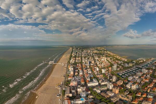 Marina Punta Faro in town Lignano Sabbiadoro Italy. Marano Lagoon meet Adriatic Sea, creating wonderful contrast of colours. Yacht Club, Bau beach Lignano, Cafe, Restaurants and hotel. Shipyard summer