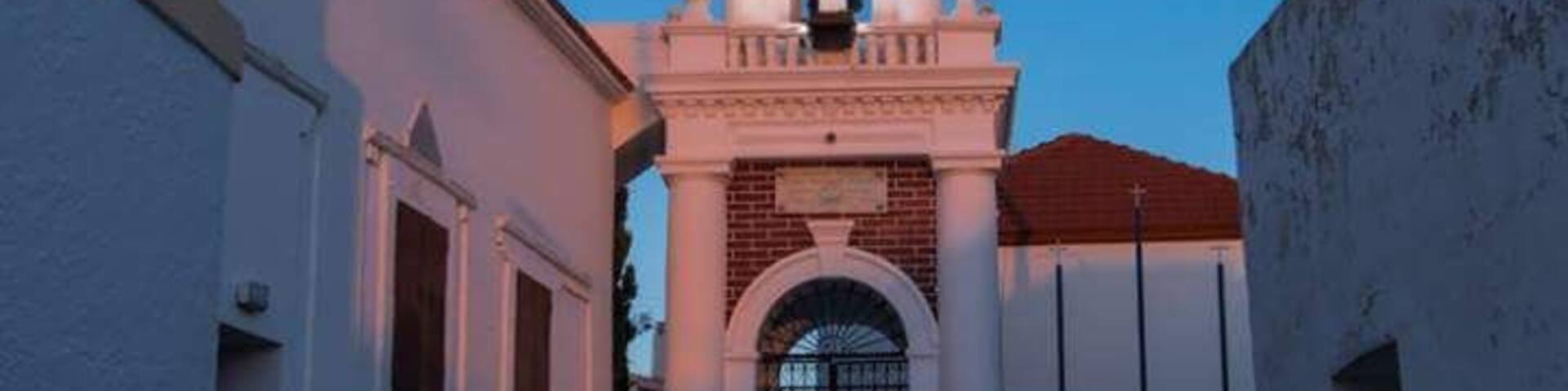Priest entering the local church on Sunday morning, shortly before the morning service.