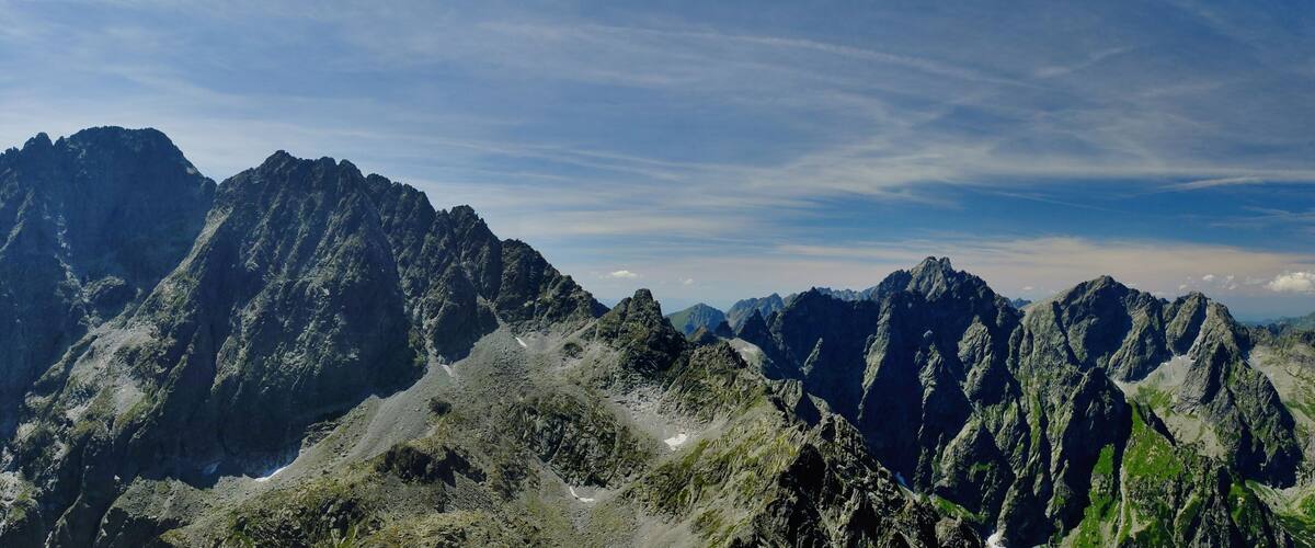 Rugged mountain peaks with a clear sky.