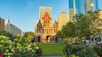 Copley Square showing a city, heritage architecture and flowers