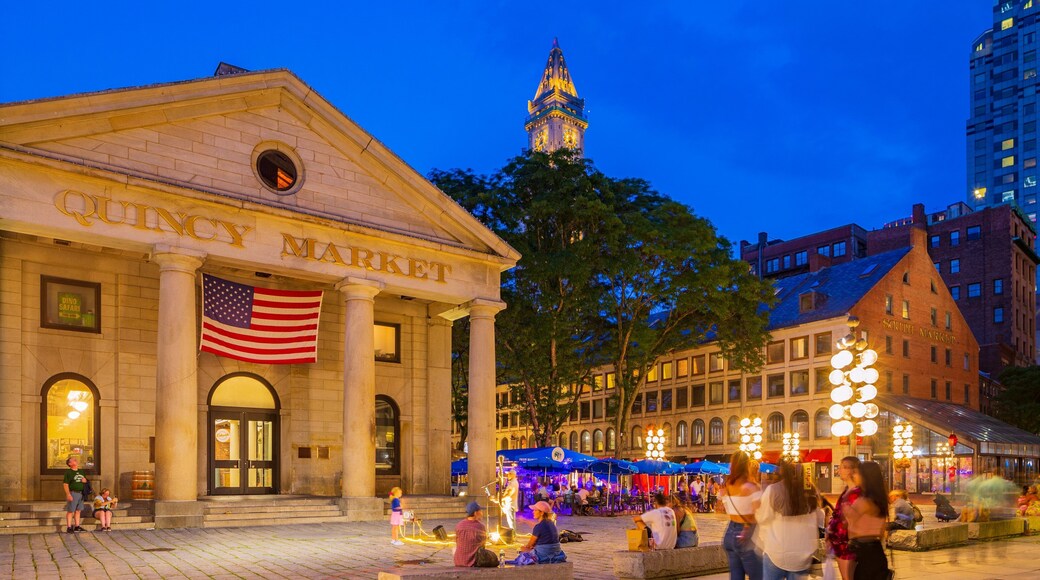 Faneuil Hall Marketplace which includes night scenes, heritage architecture and street scenes