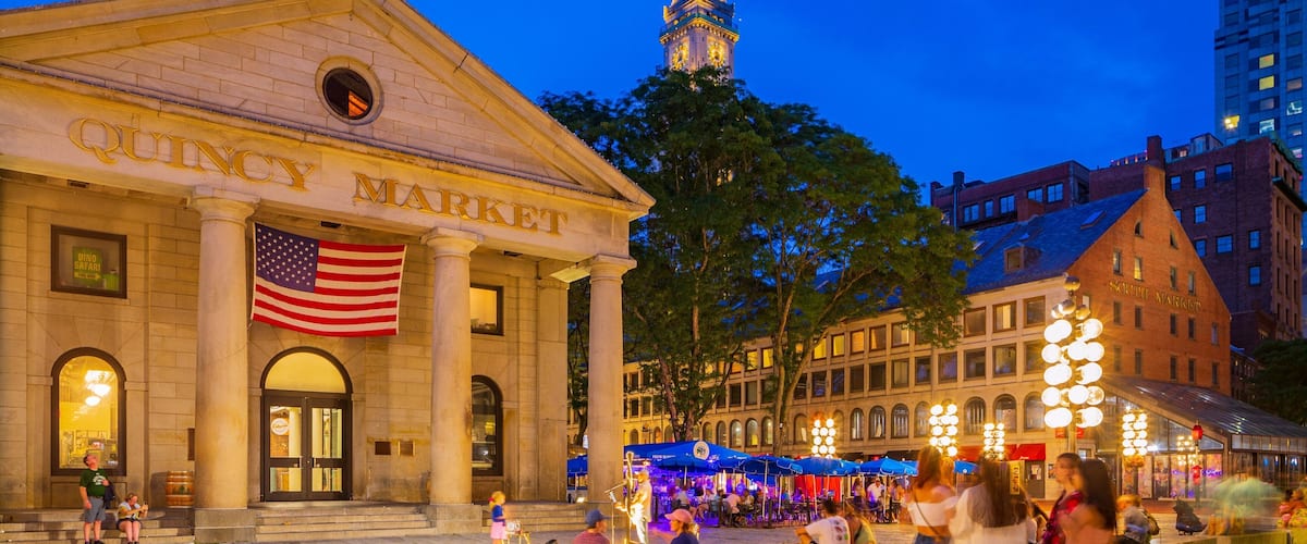 Faneuil Hall Marketplace which includes night scenes, heritage architecture and street scenes