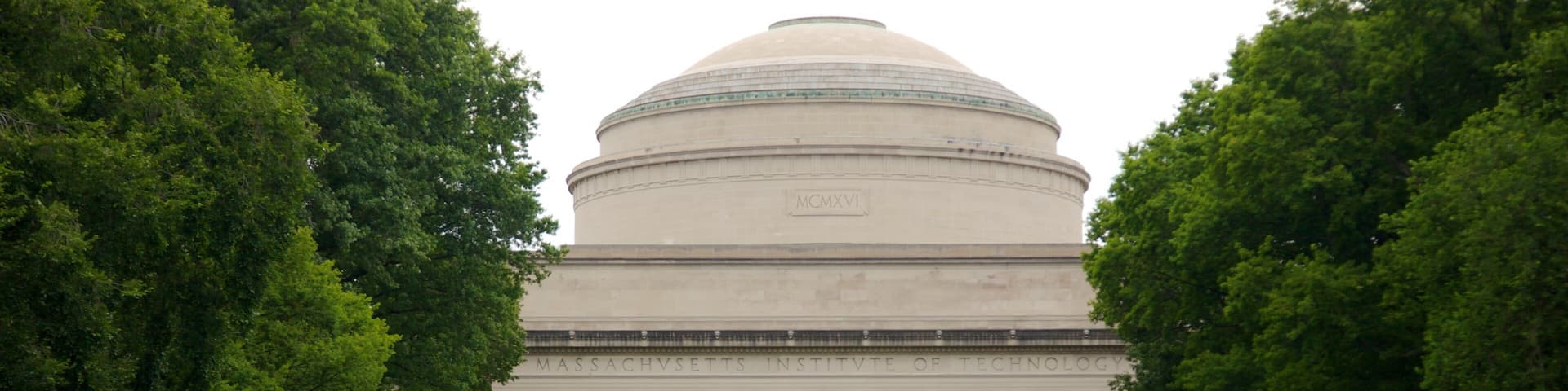 Massachusetts Institute of Technology featuring a garden as well as a small group of people