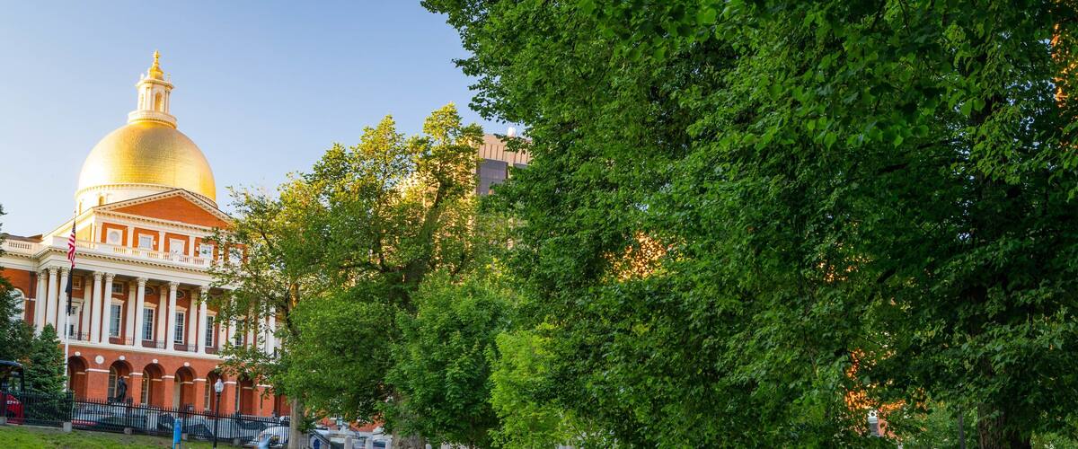 Massachusetts State House featuring an administrative buidling and a garden