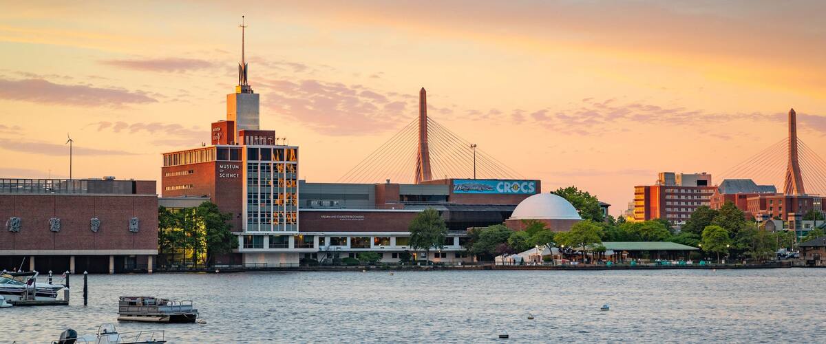 Museum of Science showing a sunset and a bay or harbor