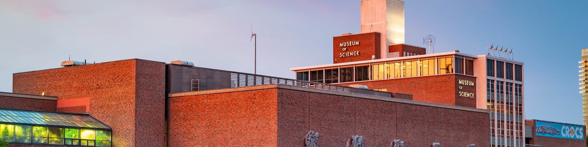 Museum of Science which includes a bay or harbor and a sunset