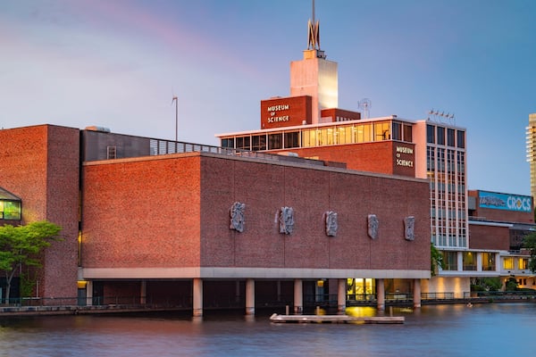 Museum of Science which includes a bay or harbor and a sunset
