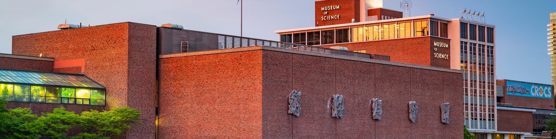 Museum of Science which includes a bay or harbor and a sunset