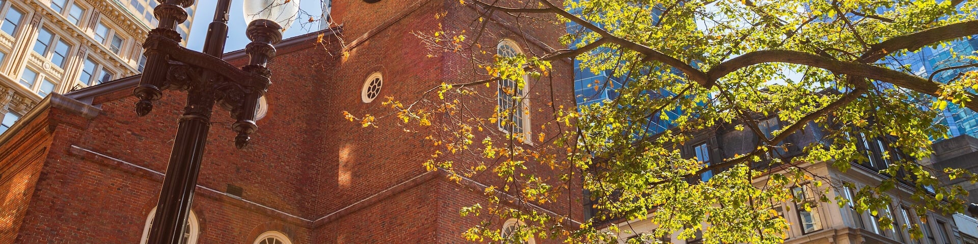 Old South Meeting House which includes heritage architecture, a sunset and a city