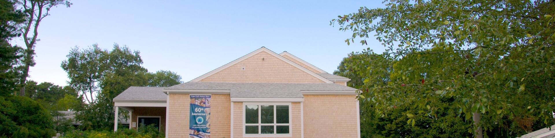 Cape Cod Museum of Natural History featuring a park and signage