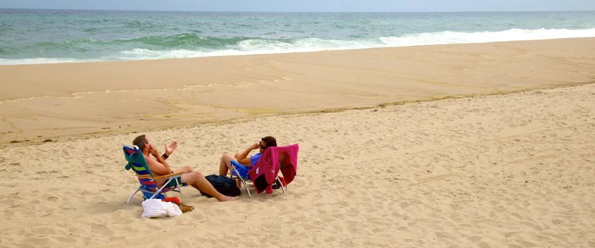 Nauset Beach featuring a beach as well as a couple