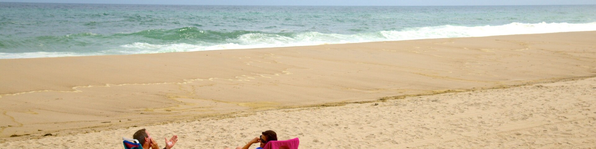 Nauset Beach featuring a beach as well as a couple