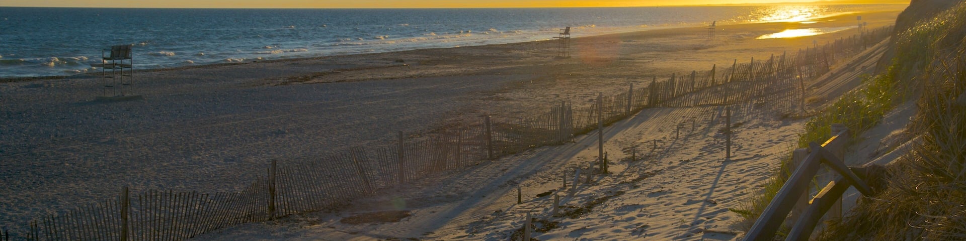 Sandy Neck Beach featuring a sandy beach and a sunset