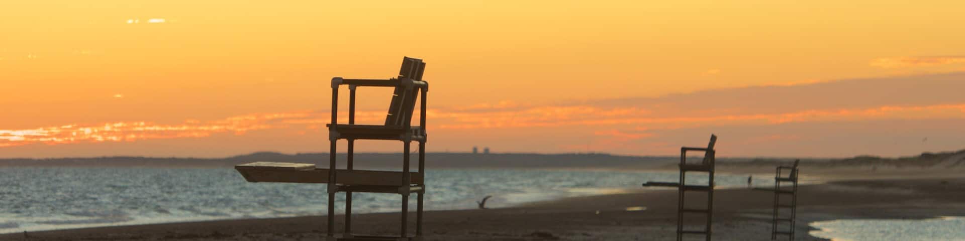 Sandy Neck Beach featuring a pebble beach and a sunset
