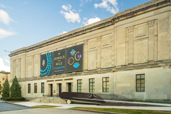 A museum building with a large display of ancient Egyptian jewelry.
