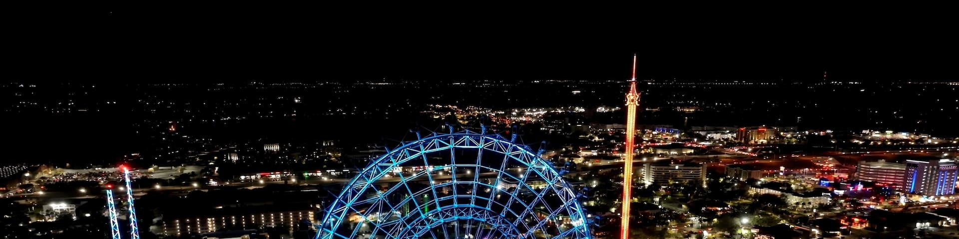 Ferris Wheel In Orlando Florida United States. Aerial View Of Exciting Amusement Park Perfect For Family Fun. Building Metropole Skyline Buildings Beautiful. Buildings Flyover Night. Orlando Florida.