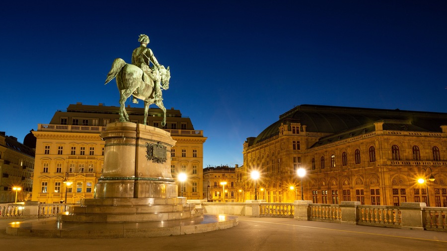 Albertina featuring night scenes, heritage architecture and a city