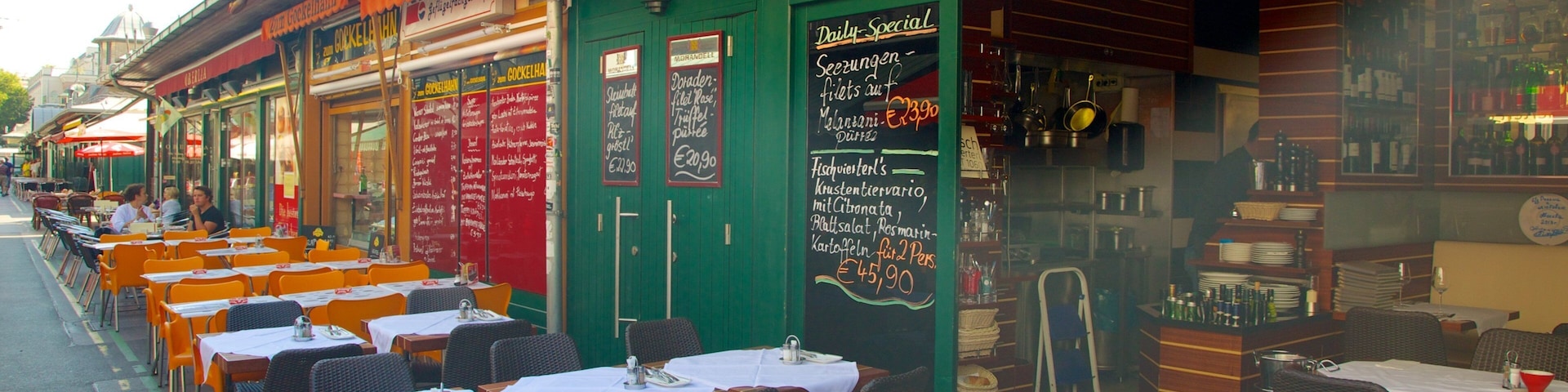 Naschmarkt which includes outdoor eating, signage and a city