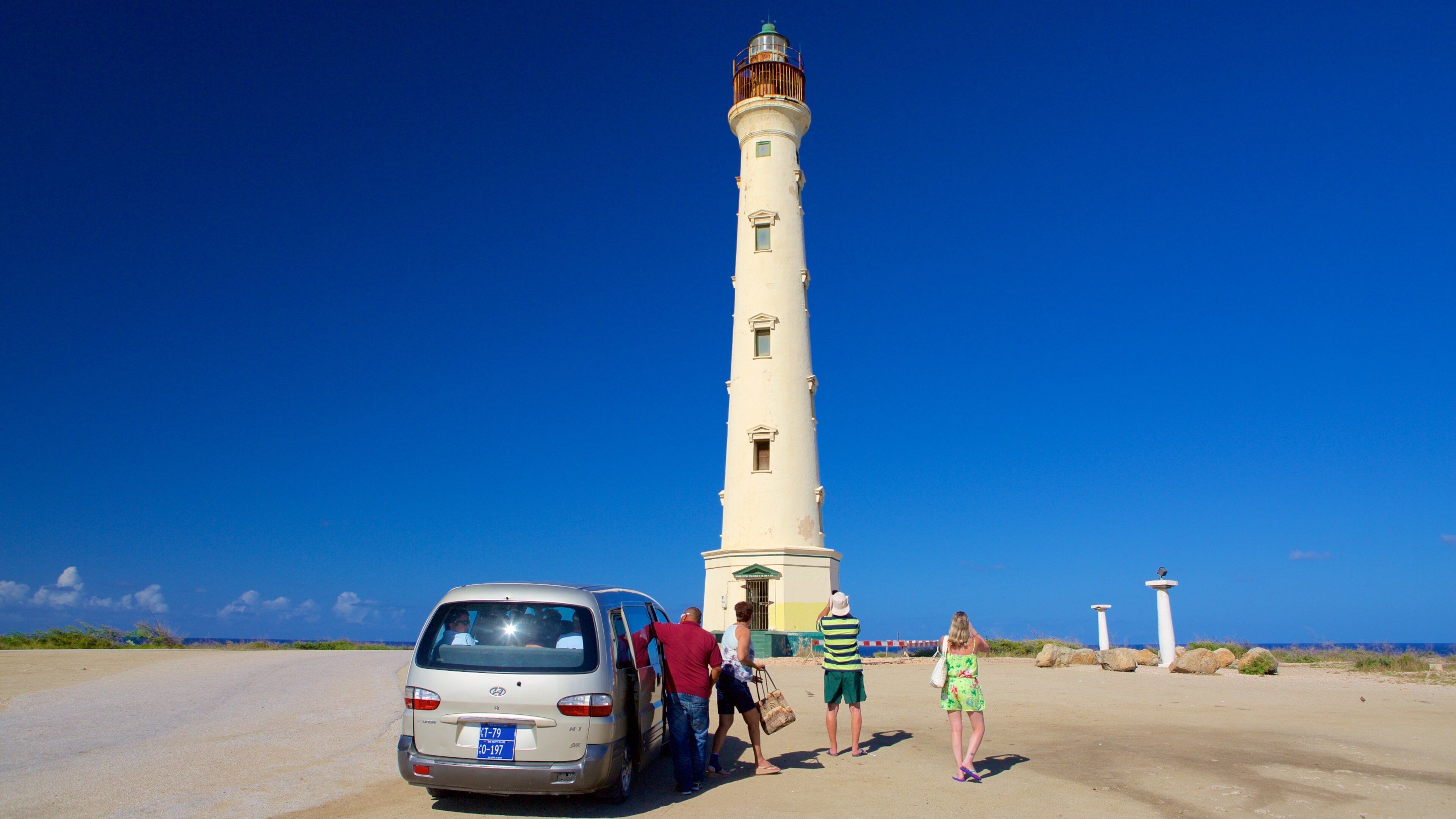 California Lighthouse showing a lighthouse as well as a small group of people