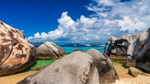 Looking our at sailboats over boulders at The Baths, Virgin Gorda, British Virgin Islands.