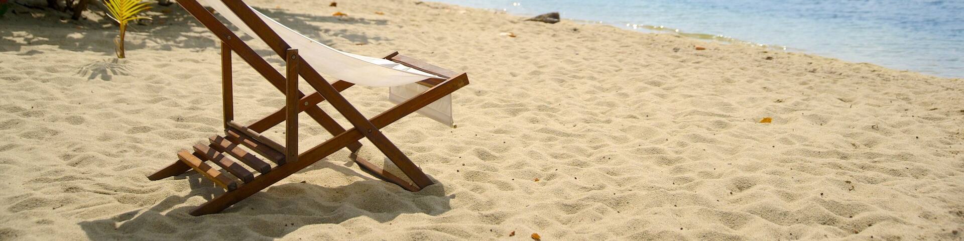 Placencia Beach which includes general coastal views and a beach