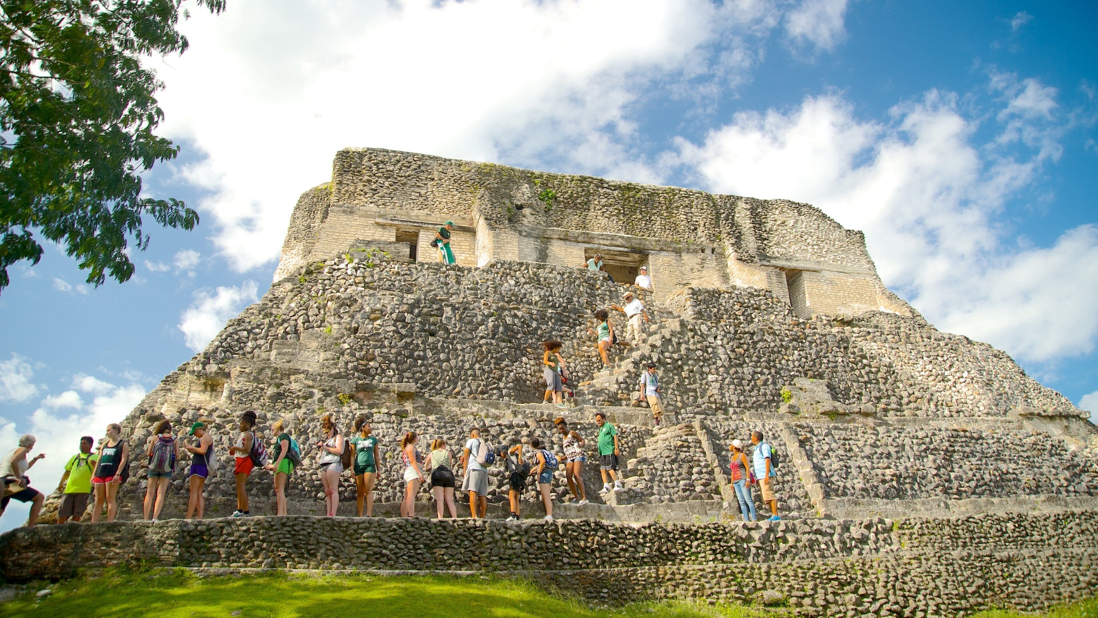 Xunantunich showing indigenous culture and heritage elements as well as a small group of people