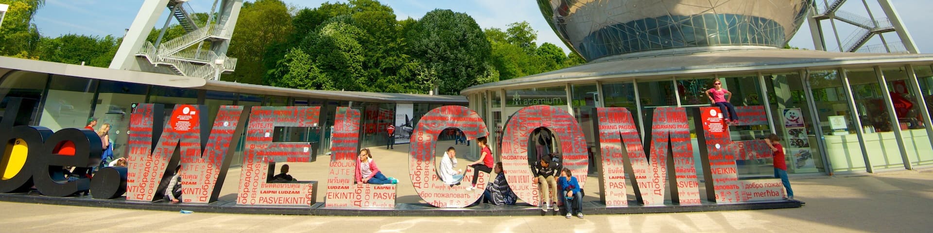 Atomium which includes a city, signage and art