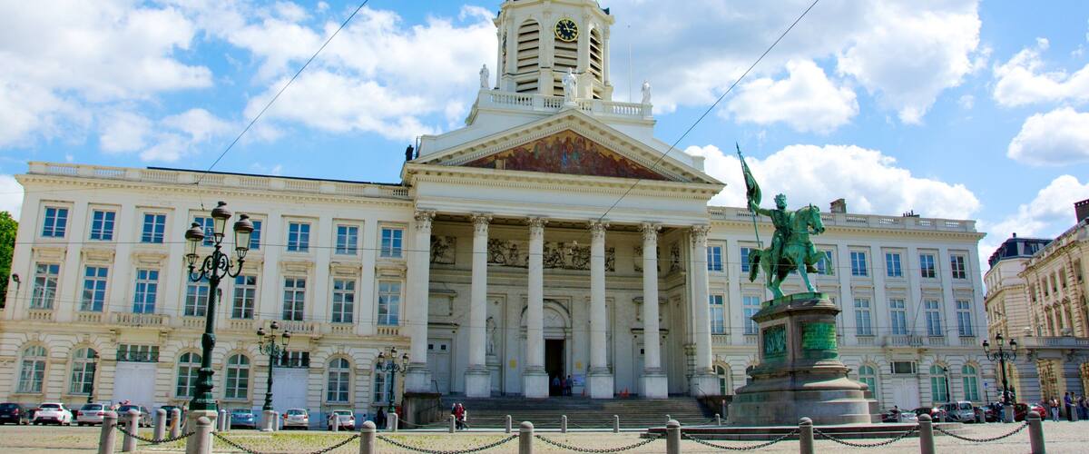 Royal Palace of Brussels which includes a statue or sculpture, a city and heritage architecture