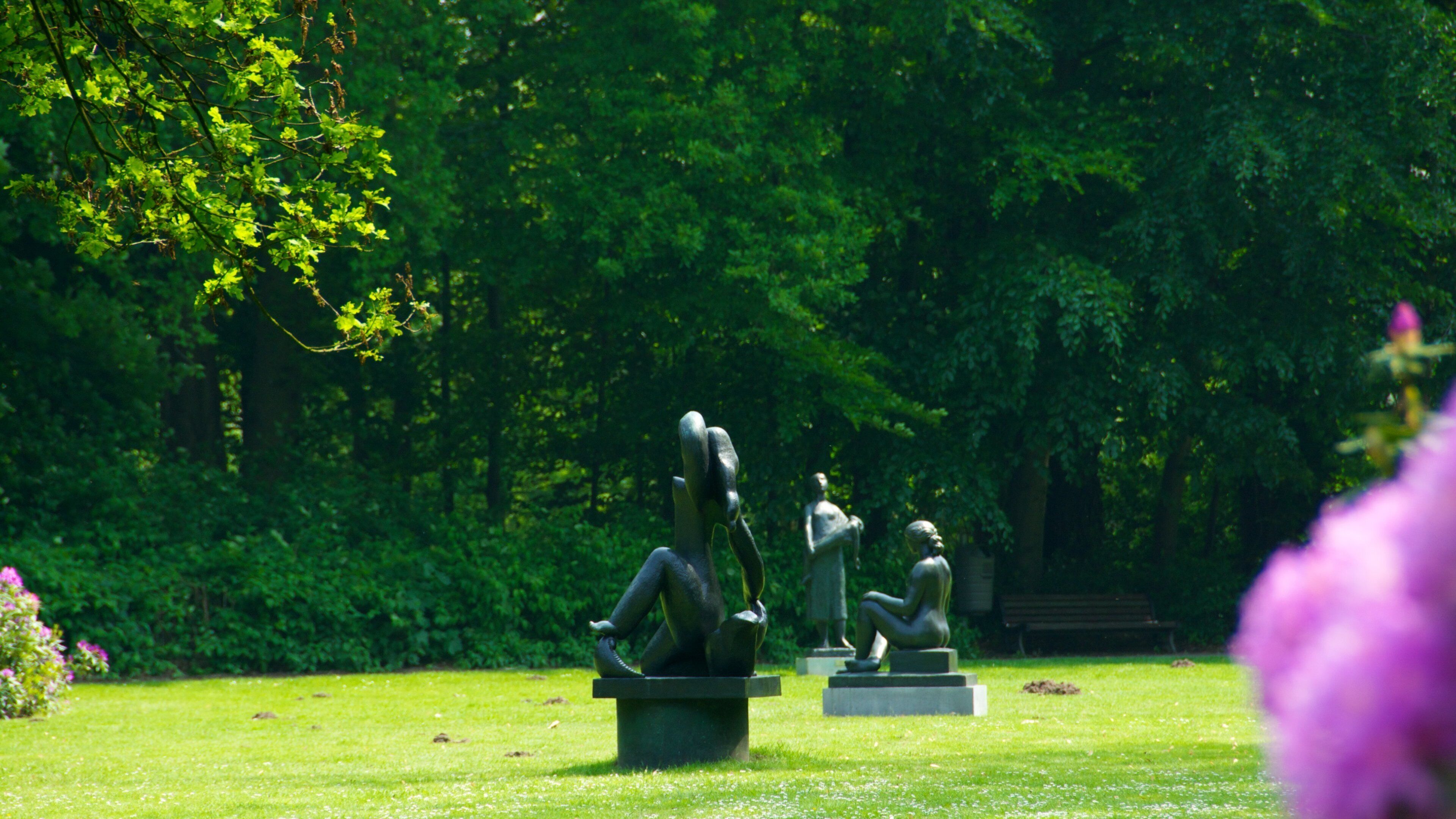 Middelheim Park featuring outdoor art, a garden and a statue or sculpture