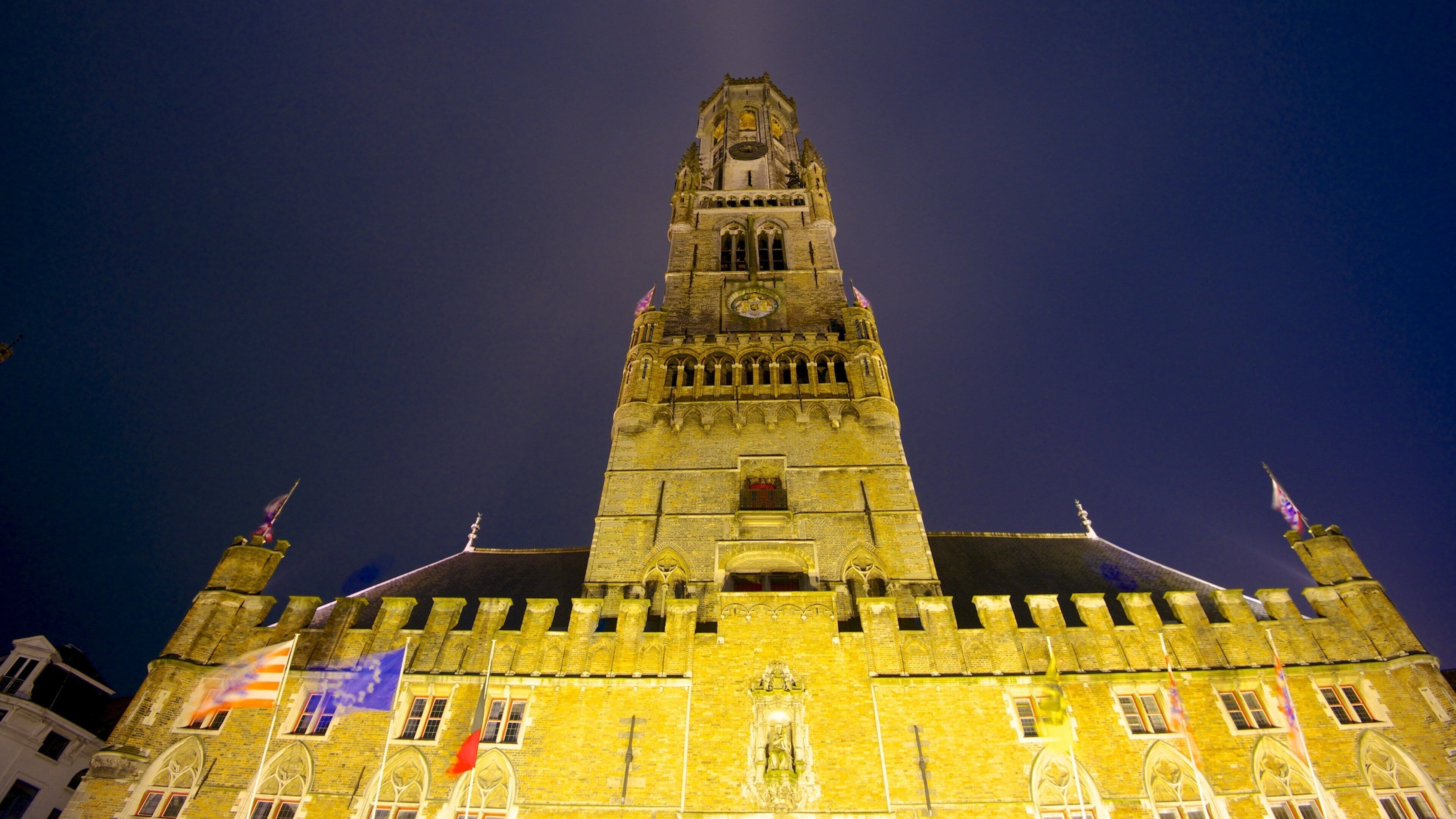 Bruges Belfry showing heritage architecture, chateau or palace and night scenes