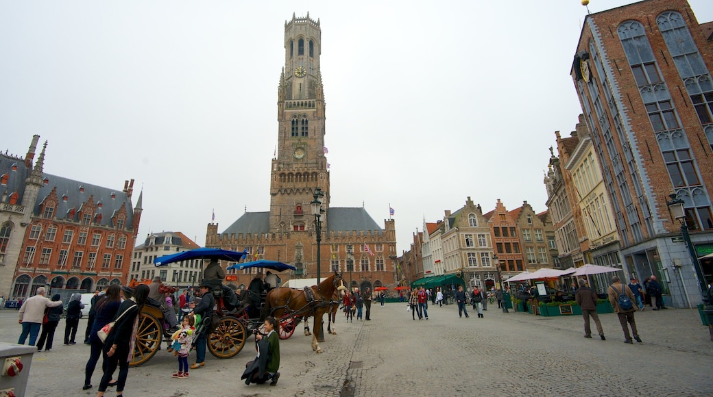 Bruges Belfry showing skyline, horseriding and a square or plaza