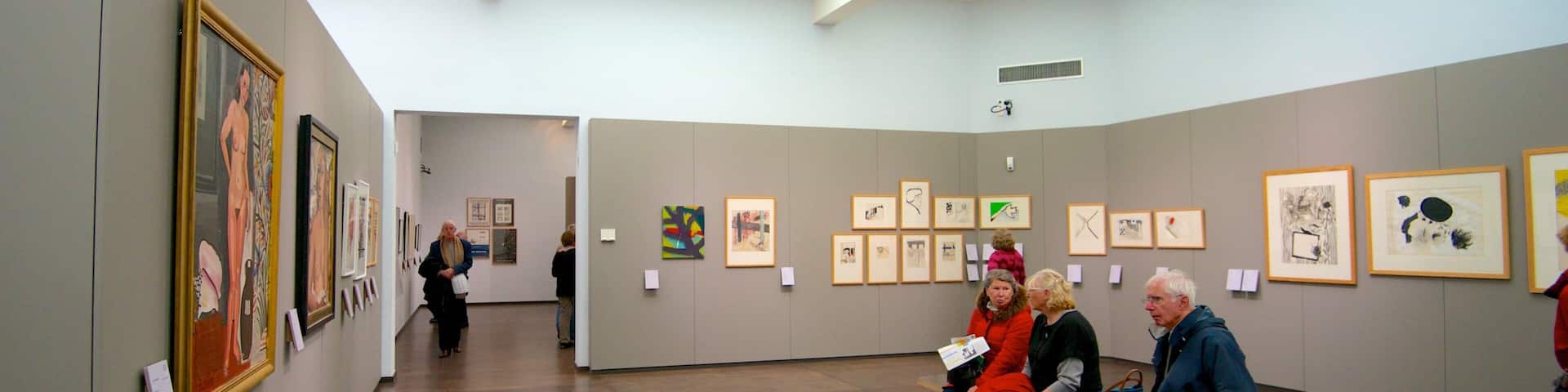 Groeningemuseum which includes interior views and art as well as a small group of people