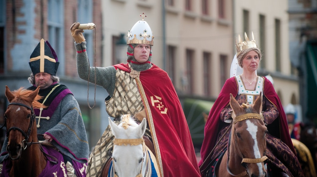 Basilica of the Holy Blood which includes performance art and street performance as well as a small group of people