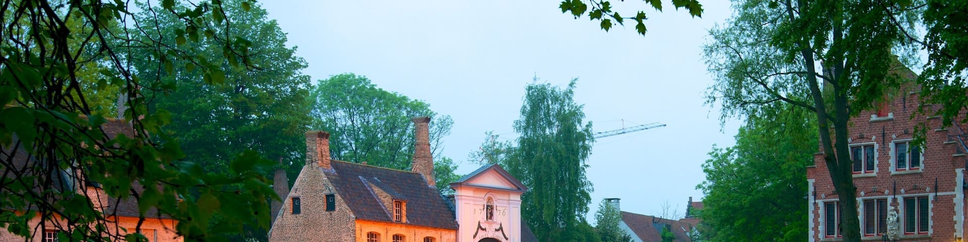 Begijnhof showing a small town or village, a river or creek and a bridge