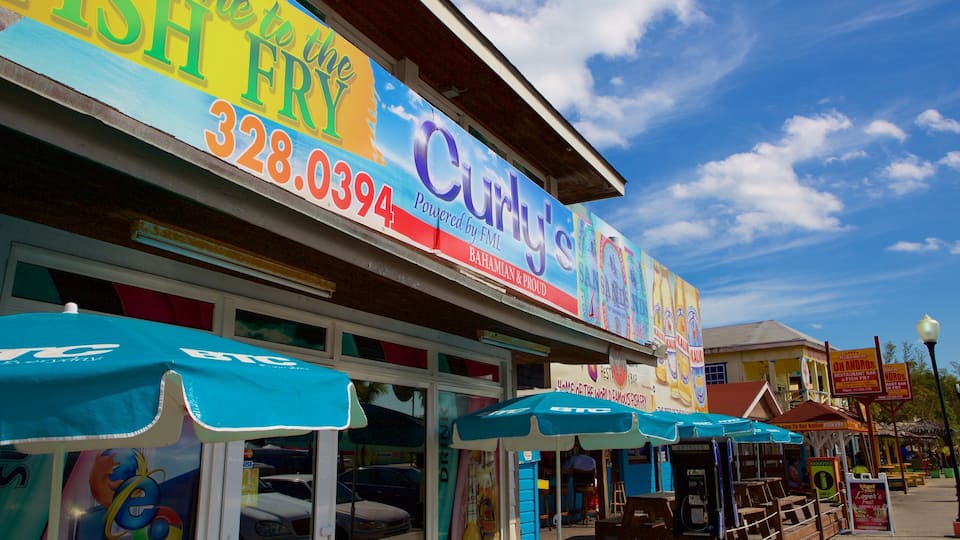 A colorful storefront with a large sign advertising fish fry and contact number 328.0394.