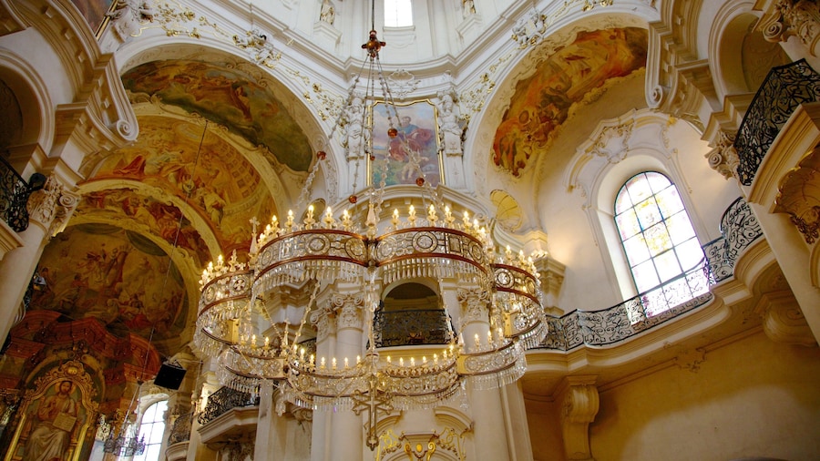 St. Nicholas Church at the Old Town Square which includes religious elements, a church or cathedral and heritage architecture