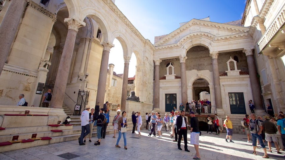 Diocletian\'s Palace showing a square or plaza as well as a large group of people