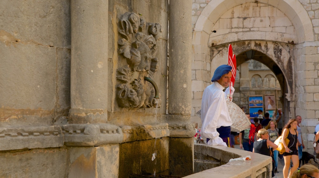 Onofrio\'s Fountain which includes heritage elements and a fountain as well as an individual male