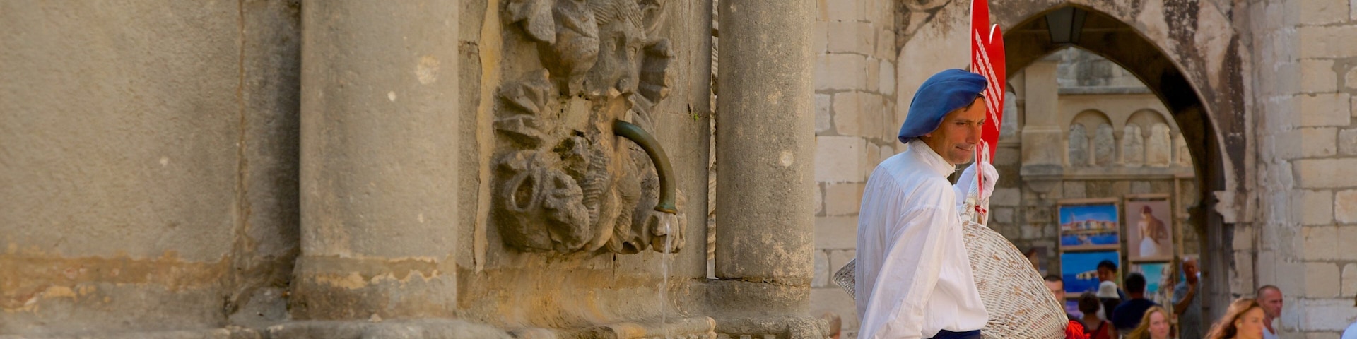 Onofrio\'s Fountain which includes heritage elements and a fountain as well as an individual male