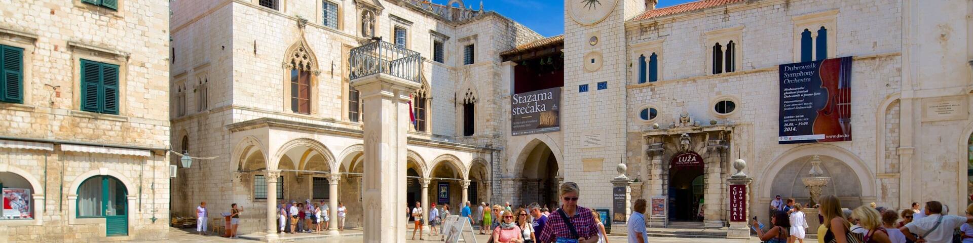 Sponza Palace featuring a square or plaza and heritage architecture as well as a small group of people