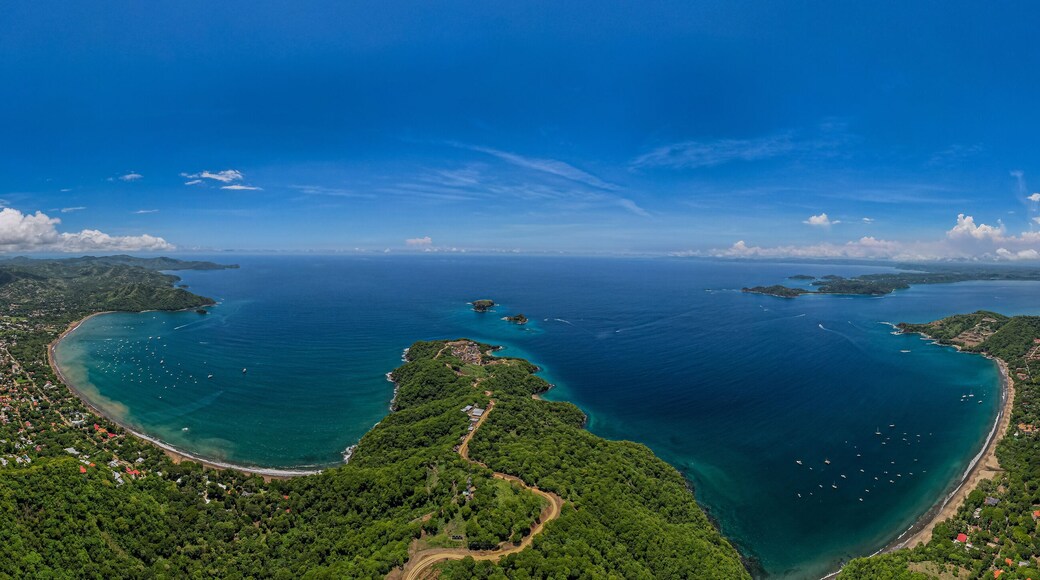 Beautiful aerial view of Playas del Coco, Hermosa Beach and its green mountains, bay and yachts in Costa Rica