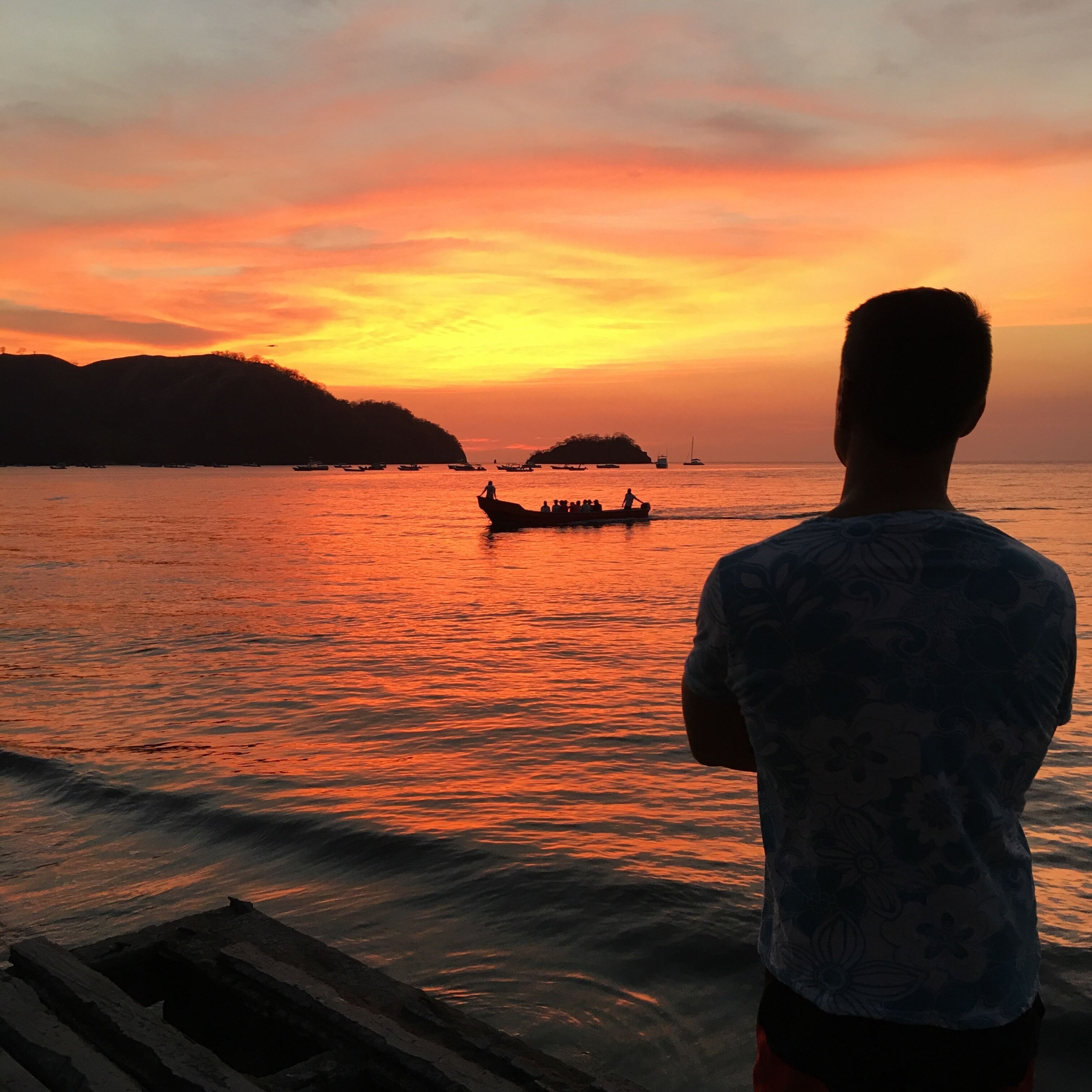 Watching the tourists come back from their catamaran sunset cruise.