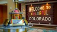 A welcome sign and a futuristic kiosk.