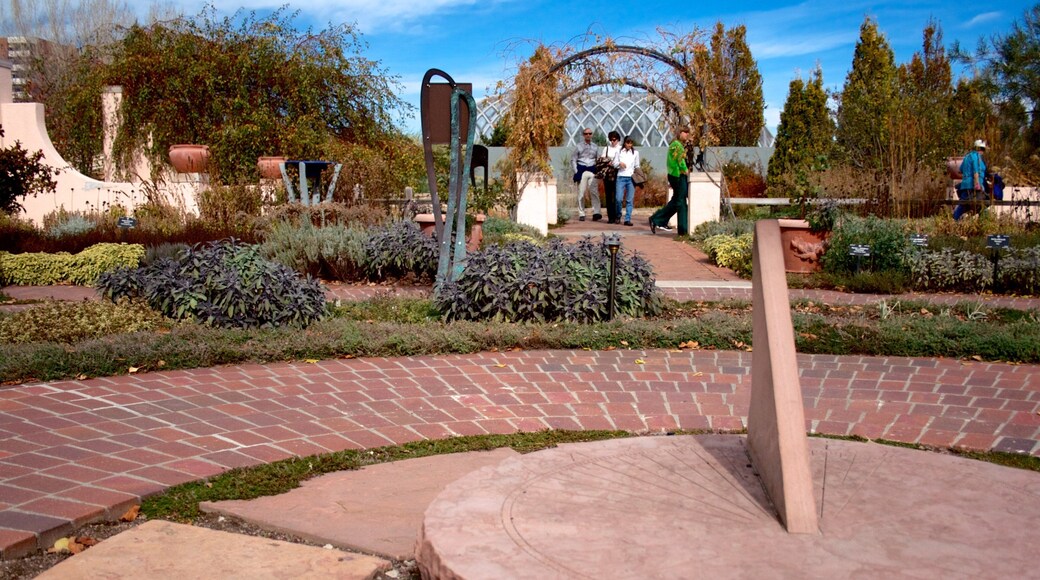 Denver Botanic Gardens featuring a park as well as a small group of people
