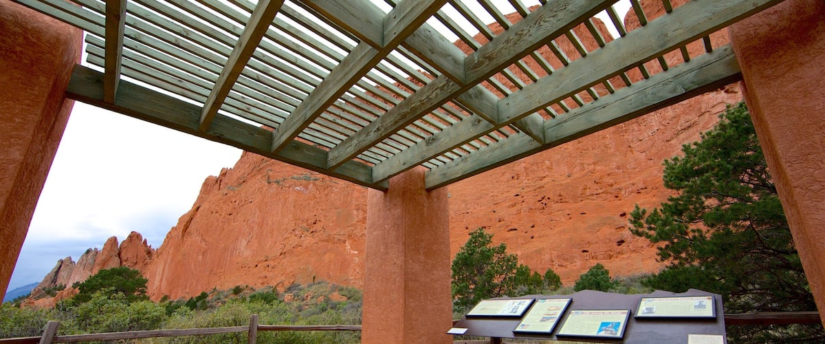 Garden of the Gods which includes signage and a gorge or canyon