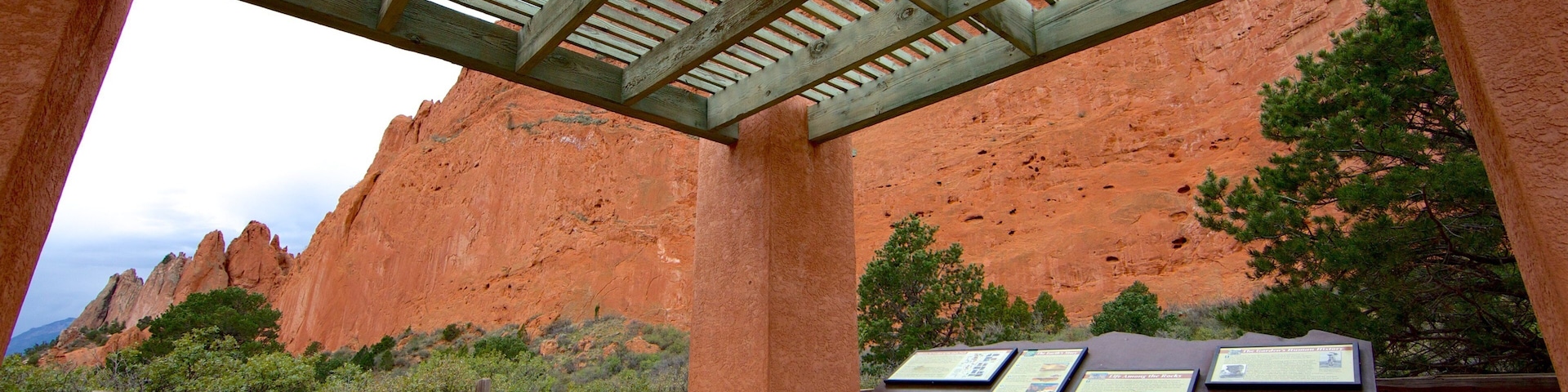 Garden of the Gods which includes signage and a gorge or canyon