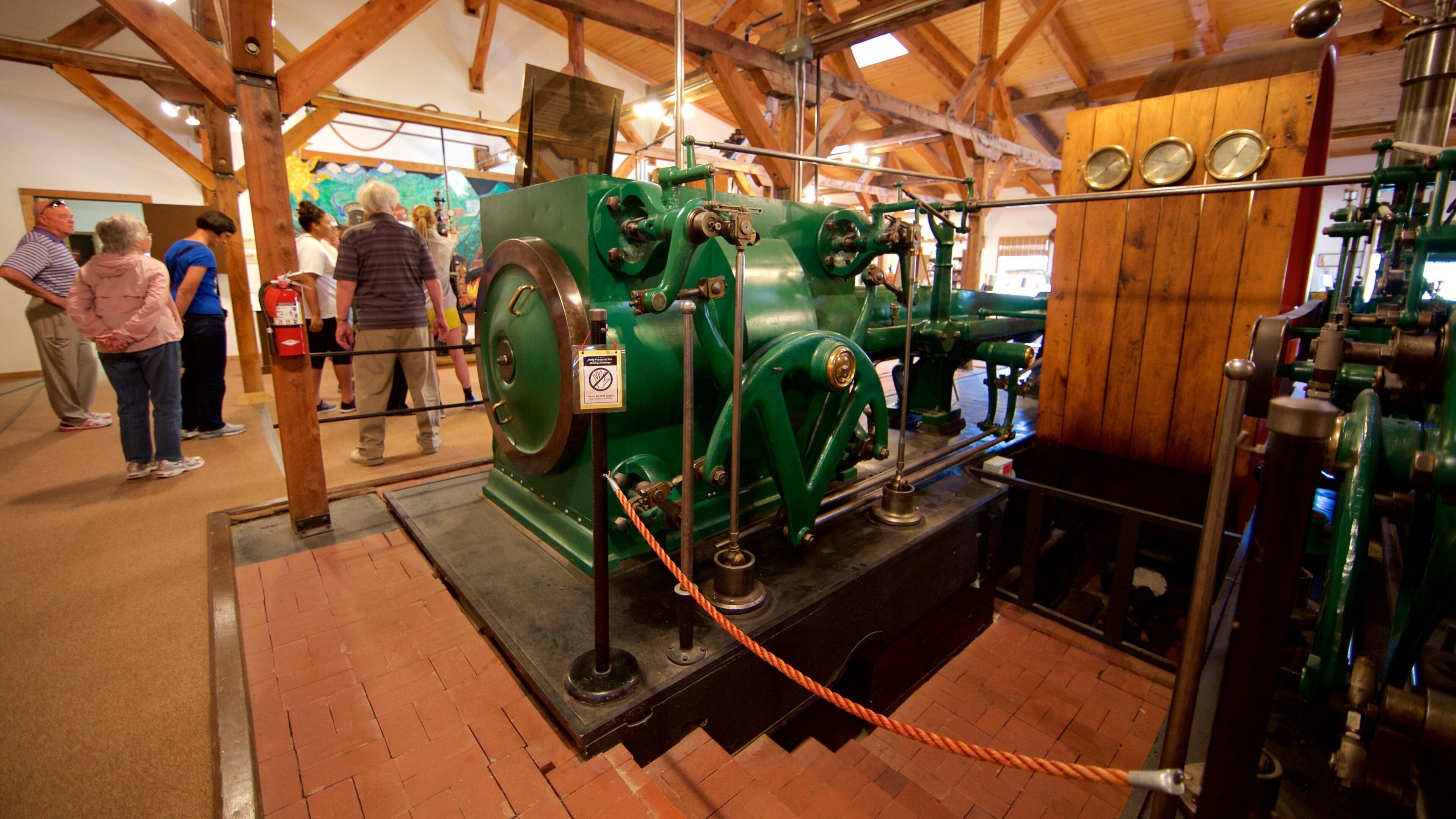 Western Museum of Mining and Industry featuring heritage elements and interior views as well as a small group of people