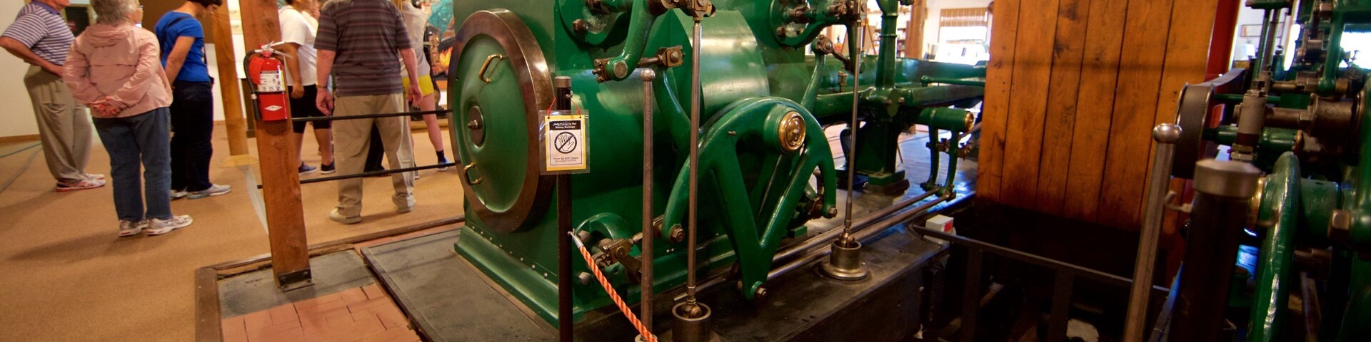 Western Museum of Mining and Industry featuring heritage elements and interior views as well as a small group of people